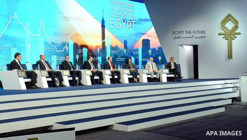 Delegates listen as Egyptian Prime Minister Ibrahim Mehleb speaks during the Egypt Economic Development Conference (EEDC) in Sharm el-Sheikh, in the South Sinai governorate, south of Cairo, March 14, 2015. Gulf Arab alli...