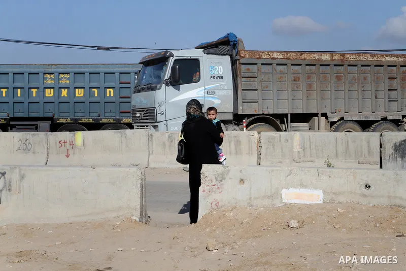 Trucks wait to enter the Kerem Shalom crossing in Rafah in southern Gaza Strip, on March 15, 2015. Gaza's agricultural sector, once a key revenue source, has for eight years been paralysed by the Israeli blockade, which...