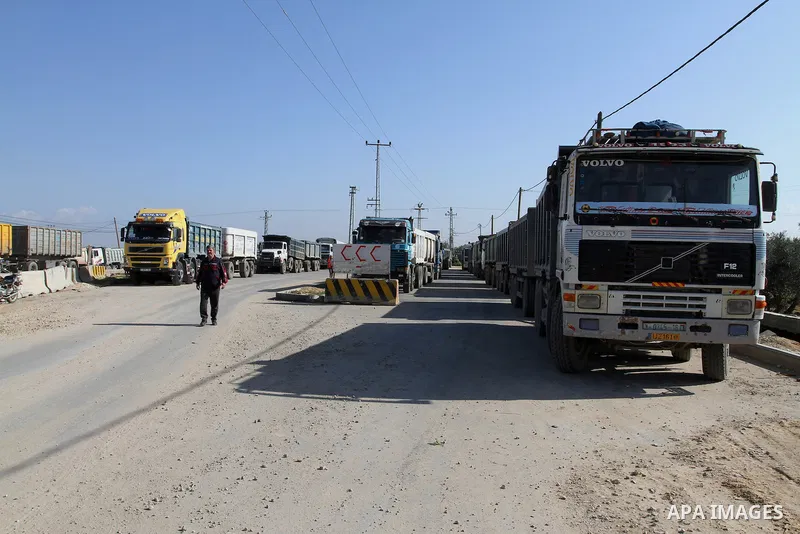Trucks wait to enter the Kerem Shalom crossing in Rafah in southern Gaza Strip, on March 15, 2015. Gaza's agricultural sector, once a key revenue source, has for eight years been paralysed by the Israeli blockade, which...