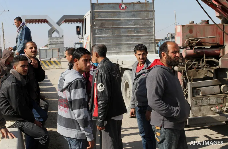 Palestinian truck drivers take part in a protest demanding their rights outside Rafah crossing in southern Gaza Strip, on March 15, 2015. Photo by Abed Rahim Khatib