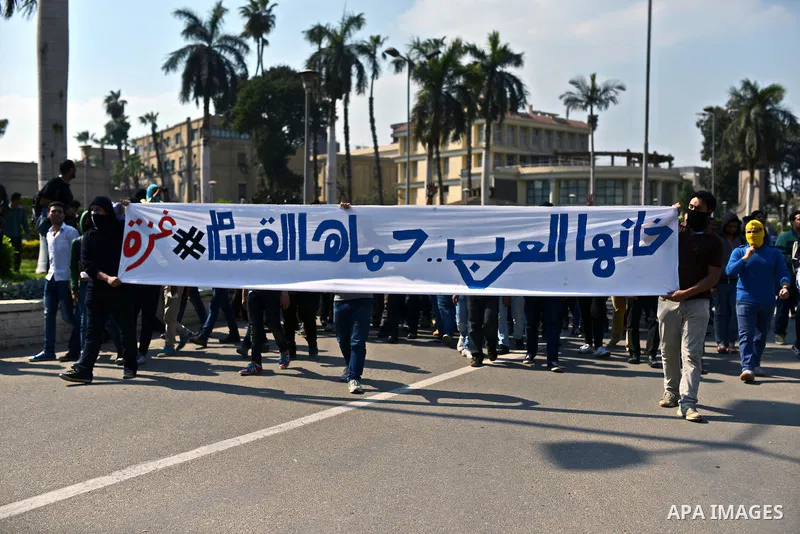 Egyptian students who support Muslim Brotherhood and ousted president Mohammed Morsi hold banners during a demonstration in solidarity with the Islamic Palestinian movement of Hamas, at Cairo University on March 15, 2015...