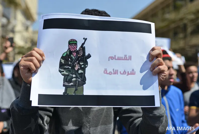 Egyptian students who support Muslim Brotherhood and ousted president Mohammed Morsi hold banners during a demonstration in solidarity with the Islamic Palestinian movement of Hamas, at Cairo University on March 15, 2015...