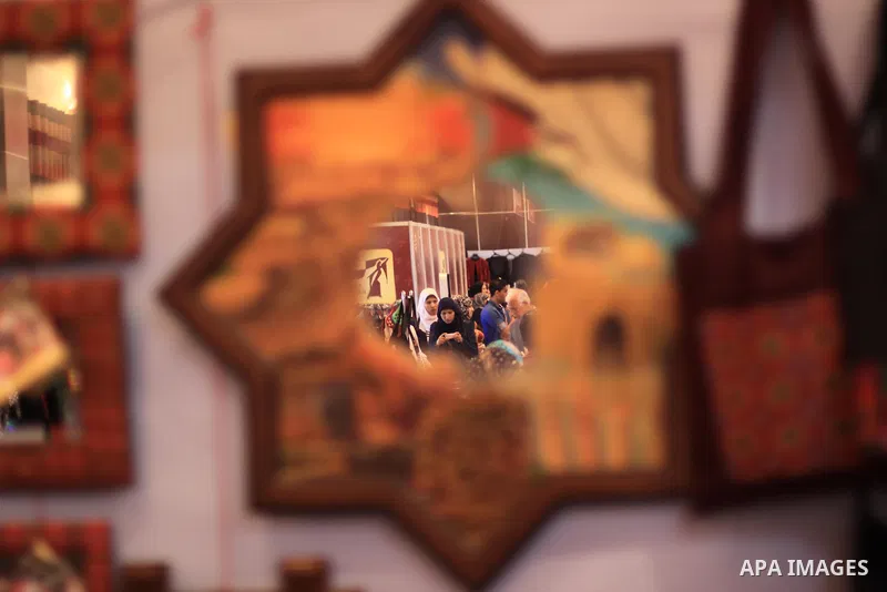Palestinians participate in the opening of an exhibition of Palestinian heritage entitled "products of our women", in Gaza City, on March 16, 2015. Photo by Mohammed Asad