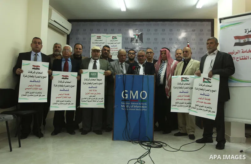Awad Abu Mazkour, the head of the association representing pilgrimage agencies and travel companies, speaks during a press conference, in Gaza city on March 18, 2015. Some 50,000 Gazans typically travel for the umrah eac...