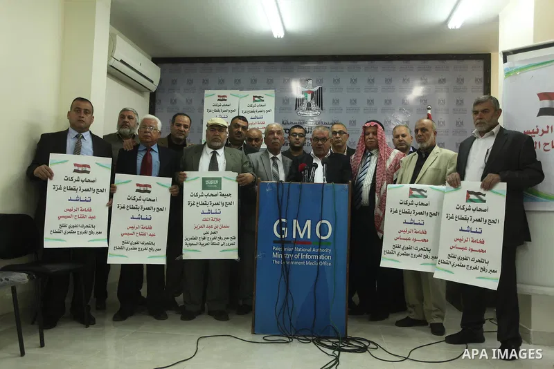 Awad Abu Mazkour, the head of the association representing pilgrimage agencies and travel companies, speaks during a press conference, in Gaza city on March 18, 2015. Some 50,000 Gazans typically travel for the umrah eac...