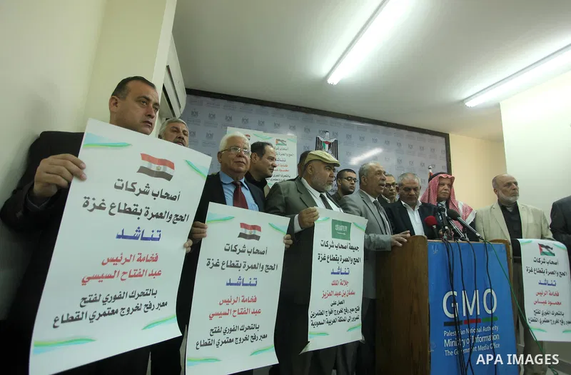 Awad Abu Mazkour, the head of the association representing pilgrimage agencies and travel companies, speaks during a press conference, in Gaza city on March 18, 2015. Some 50,000 Gazans typically travel for the umrah eac...