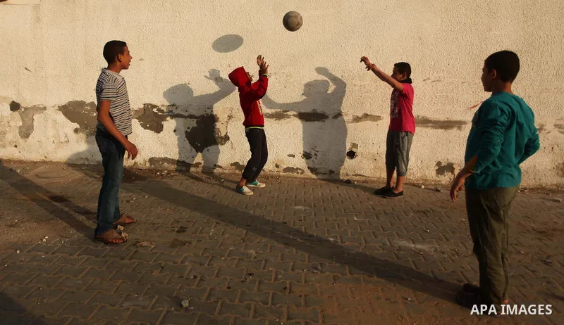 Palestinian children play outside their family's home in al-Shatie refugee camp, in Gaza city on March 18, 2015. Israel's Prime Minister Benjamin Netanyahu won a come-from-behind victory in Israel's election after tackin...