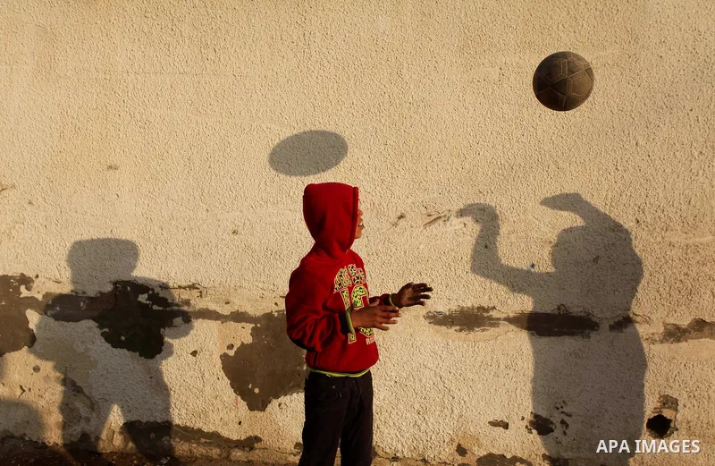 Palestinian children play outside their family's home in al-Shatie refugee camp, in Gaza city on March 18, 2015. Israel's Prime Minister Benjamin Netanyahu won a come-from-behind victory in Israel's election after tackin...