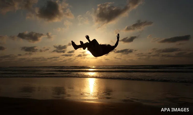 A Palestinian youth demonstrates his skills during the sunset at the beach of the Gaza city on March 18, 2015. Israel's Prime Minister Benjamin Netanyahu won a come-from-behind victory in Israel's election after tacking...