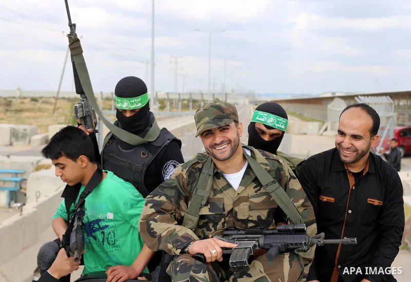 Palestinian 37-year-old Ismail al-Zahar is greeted by relatives after his release from an Israeli jail in Gaza City on March 19, 2015. Photo by Stranger