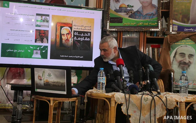 Senior leader of Hamas Ismail Haniyeh speaks during his visit to the home of the late Hamas spiritual leader Sheikh Ahmed Yassin, marking the 11th anniversary of his death in Gaza City, March 22, 2015. Photo by Ashraf Am...
