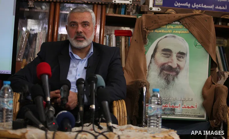 Senior leader of Hamas Ismail Haniyeh speaks during his visit to the home of the late Hamas spiritual leader Sheikh Ahmed Yassin, marking the 11th anniversary of his death in Gaza City, March 22, 2015. Photo by Ashraf Am...
