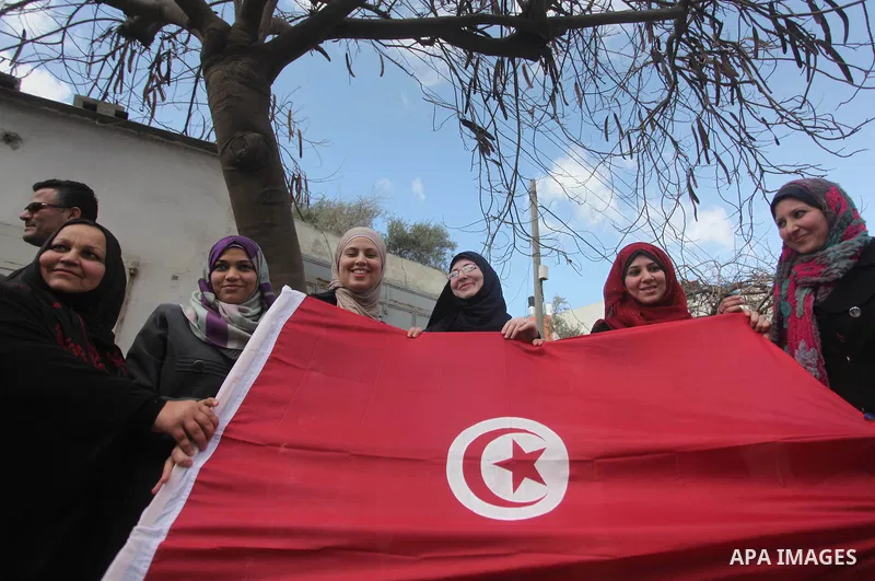 Palestinian take part in a protest to show solidarity with Tunisia after the terrorist attack at the Bardo Museum which caused 22 dead and 50 wounded among the tourists, in front of the Tunisian community, in Gaza city,...
