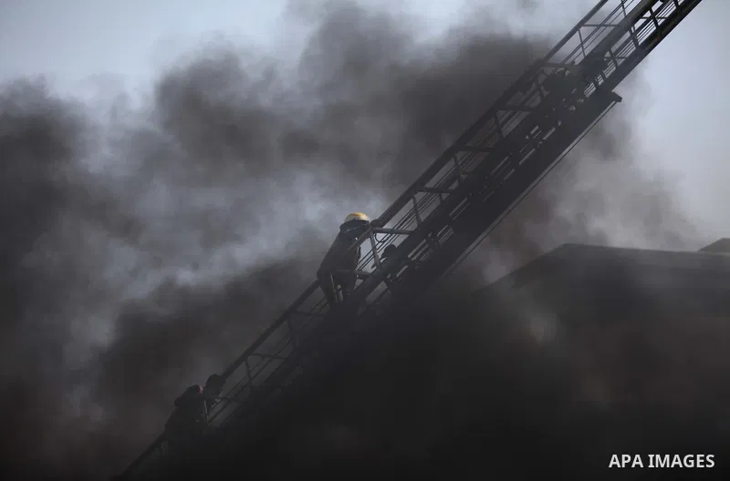 Palestinian Civil Defense members and students take part in a drill at a scene simulating a fire at University College of Applied Sciences by an Israeli air strike, in Gaza city March 24, 2015. Photo by Ashraf Amra