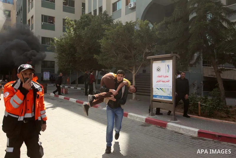 Palestinian Civil Defense members and students take part in a drill at a scene simulating a fire at University College of Applied Sciences by an Israeli air strike, in Gaza city March 24, 2015. Photo by Ashraf Amra