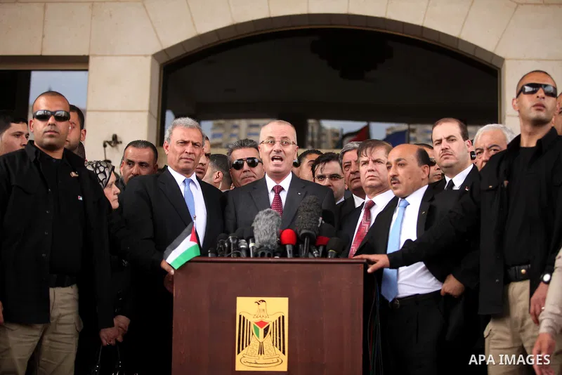 Palestinian Prime Minister Rami Hamdallah speaks during a press conference in Gaza City March 25, 2015. Hamdallah, who arrived to Gaza on Wednesday, urged donor countries to fulfill their financial obligations for the re...