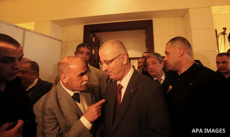 Palestinian Prime Minister Rami Hamdallah arrives to meet with Palestinian factions, in Gaza City March 25, 2015. Hamdallah, who arrived to Gaza on Wednesday, urged donor countries to fulfill their financial obligations...