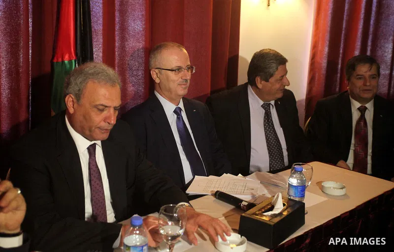 Palestinian prime minister Rami Hamdallah attends a meeting with Palestinian factions and parties in Gaza Strip, in Gaza city on March 26, 2015. Hamdallah urged rival factions to set aside their differences, even as prot...
