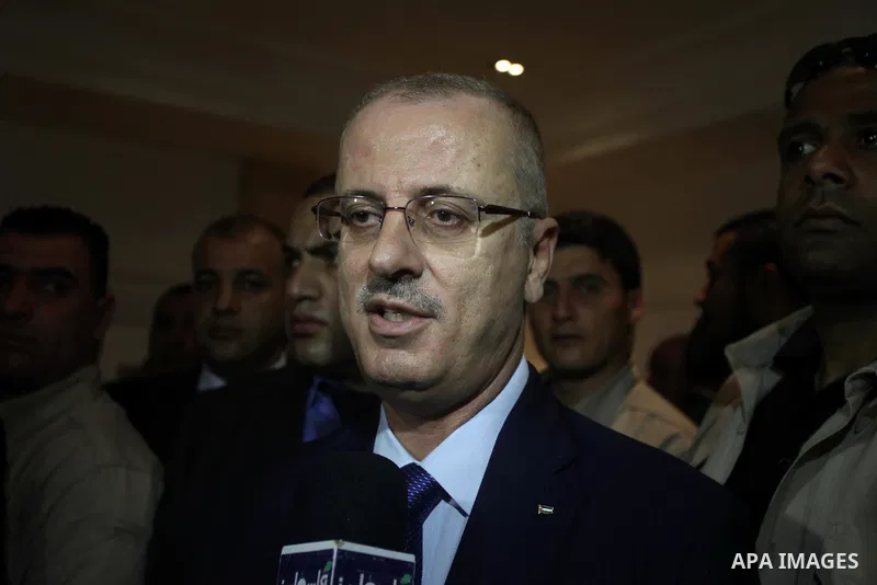 Palestinian prime minister Rami Hamdallah speaks to media following a meeting with Palestinian factions and parties in Gaza Strip, in Gaza city on March 26, 2015. Hamdallah urged rival factions to set aside their differe...