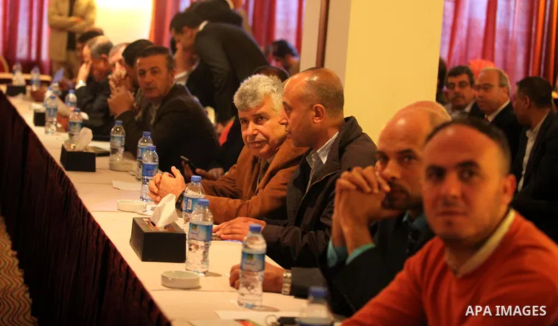 Palestinian businessmen and independent figures attend a meeting with Palestinian prime minister Rami Hamdallah during his visit to the Gaza Strip, in Gaza city on March 26, 2015. Hamdallah urged rival factions to set as...