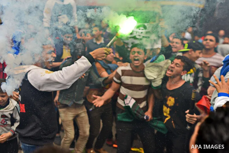 Egyptian supporters of Muslim Brotherhood and ousted president Mohammed Morsi light flares during a demonstration against military rule in al-Matariya district, in Cairo on March 27, 2015. Photo by Amr Sayed