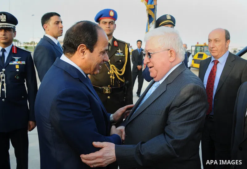 A handout picture made available by the Egyptian presidency shows Egyptian President Abdel Fattah al-Sisi (L) welcoming Iraqi President Fuad Masum upon the latter's arrival in Red Sea resort of Sharm El-Sheikh on March 2...