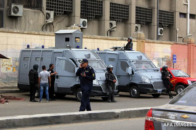 Egyptian security forces inspect the site after a bomb exploded outside the main gate of Cairo University, in Cairo, on march 28 , 2015. Eight people were injured during the explosion and sent to nearby hospitals, Health...