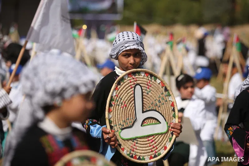 Palestinians artists paint artworks during an activity marking Land Day in Gaza City March 30, 2015. Palestinians mark Land Day on March 30, the annual commemoration of protests in 1976 against Israel's appropriation of...