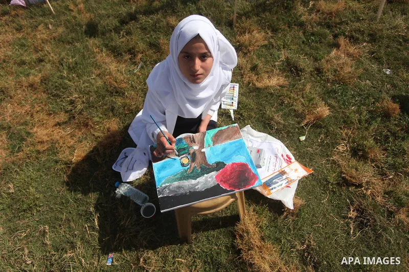 Palestinians artists paint artworks during an activity marking Land Day in Gaza City March 30, 2015. Palestinians mark Land Day on March 30, the annual commemoration of protests in 1976 against Israel's appropriation of...