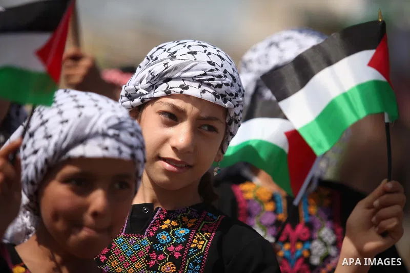 Palestinians artists paint artworks during an activity marking Land Day in Gaza City March 30, 2015. Palestinians mark Land Day on March 30, the annual commemoration of protests in 1976 against Israel's appropriation of...