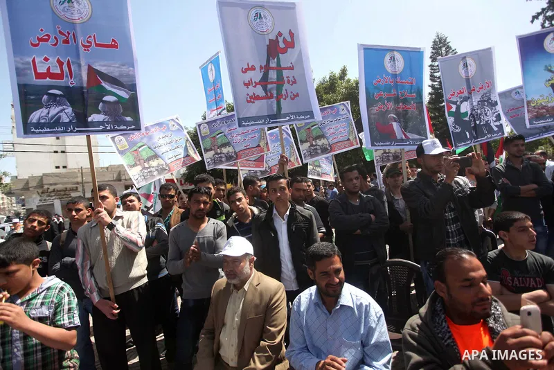 Protesters rake part a rally marking Land Day in Gaza City March 30, 2015.The annual demonstrations mark the deaths of six Arab Israeli protesters at the hands of Israeli police and troops during mass protests in 1976 ag...