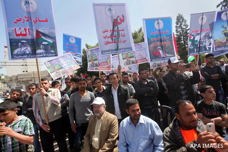 Protesters rake part a rally marking Land Day in Gaza City March 30, 2015.The annual demonstrations mark the deaths of six Arab Israeli protesters at the hands of Israeli police and troops during mass protests in 1976 ag...