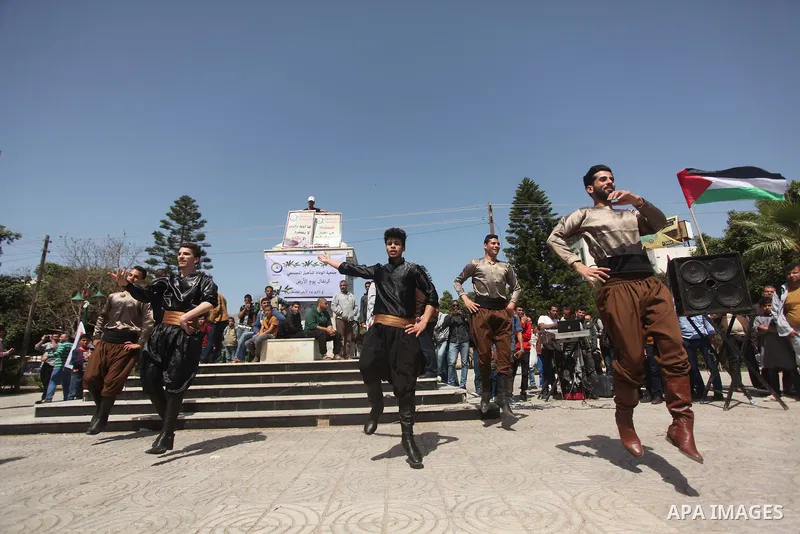 Palestinians youth participate in dancing of "Dabka" during a rally marking Land Day in Gaza City March 30, 2015.The annual demonstrations mark the deaths of six Arab Israeli protesters at the hands of Israeli police and...