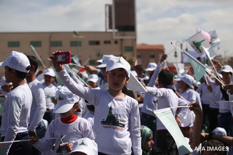 Palestinian orphans attend a ceremony to mark the Orphan Day, in Gaza city, on April 2, 2015. Photo by Ashraf Amra