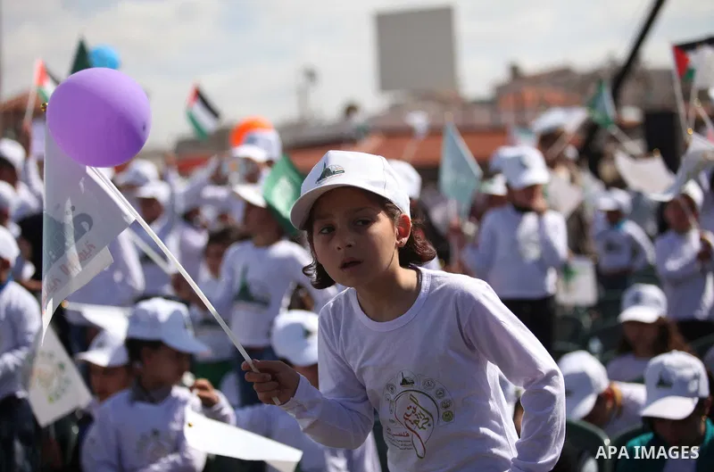 Palestinian orphans attend a ceremony to mark the Orphan Day, in Gaza city, on April 2, 2015. Photo by Ashraf Amra