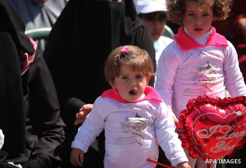 Palestinian orphans attend a ceremony to mark the Orphan Day, in Gaza city, on April 2, 2015. Photo by Ashraf Amra