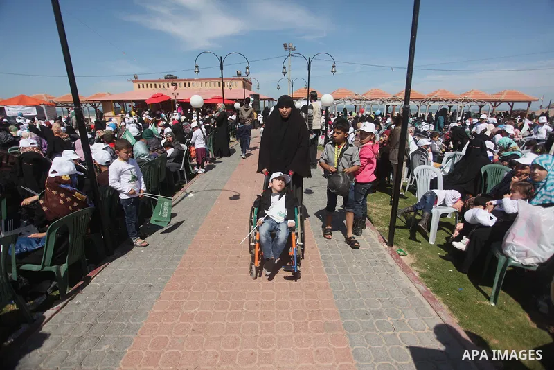 Palestinian orphans attend a ceremony to mark the Orphan Day, in Gaza city, on April 2, 2015. Photo by Ashraf Amra