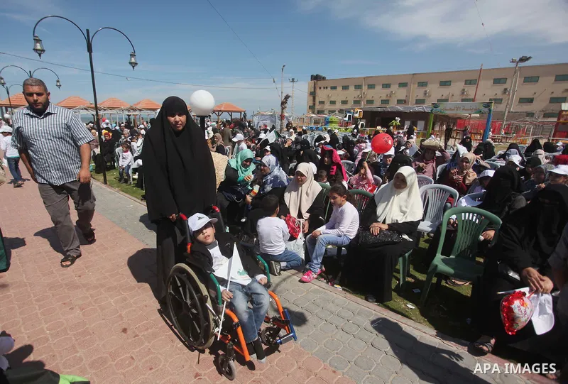 Palestinian orphans attend a ceremony to mark the Orphan Day, in Gaza city, on April 2, 2015. Photo by Ashraf Amra