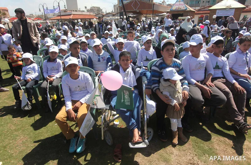 Palestinian orphans attend a ceremony to mark the Orphan Day, in Gaza city, on April 2, 2015. Photo by Ashraf Amra