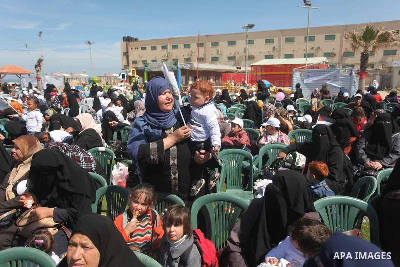 Palestinian orphans attend a ceremony to mark the Orphan Day, in Gaza city, on April 2, 2015. Photo by Ashraf Amra