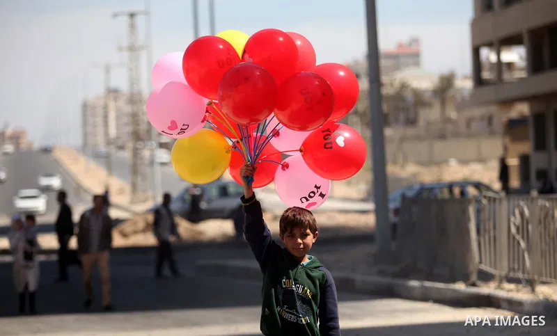 Palestinian orphans attend a ceremony to mark the Orphan Day, in Gaza city, on April 2, 2015. Photo by Ashraf Amra