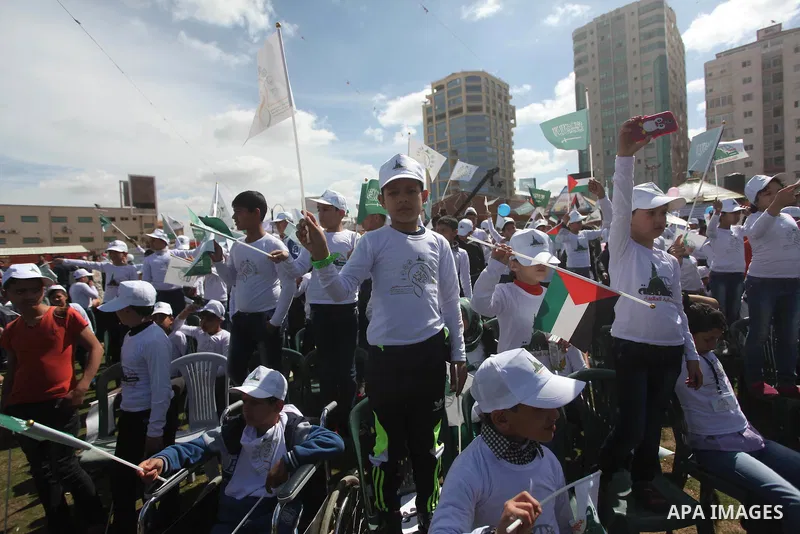 Palestinian orphans attend a ceremony to mark the Orphan Day, in Gaza city, on April 2, 2015. Photo by Ashraf Amra