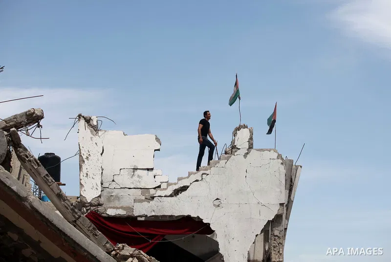 A Palestinian man walks on the rubble of his house that was destroyed during the 50-day Israeli war on Gaza Strip in the summer of 2014, in Gaza City's al-Shejaiya neighbourhood, on April 2, 2015. The Palestinians formal...