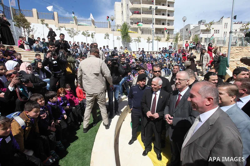 A picture released by the Palestinian Prime Minister office shows Palestinian Prime Minister Rami Hamdallah participating in the opening ceremony of al-Salam park in the West Bank city of Hebron, April 2, 2015. PMO