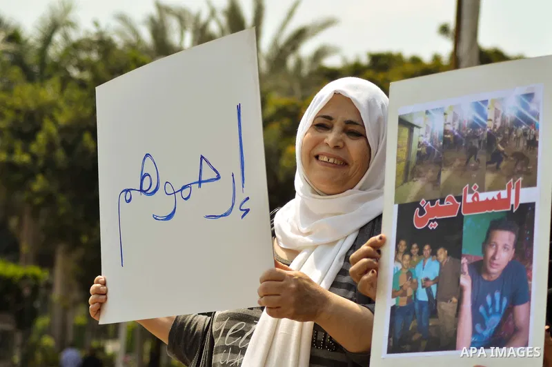 Egyptian women hold banners during a protest demanding animal rights in front of the Opera, Cairo, Egypt on April 4, 2015. Photo by Amr Sayed
