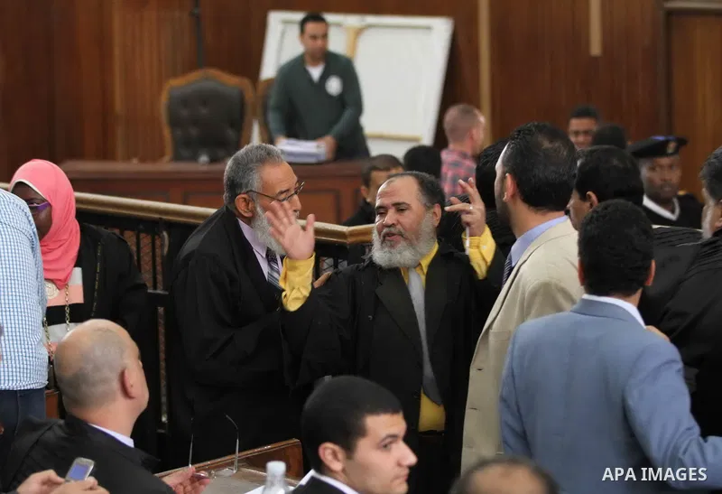 Egyptian lawyers attend the trial of defendants of Ansar Bayt al-Maqdis in Cairo on April 4, 2015. 213 defendant members of Ansar al-Bayt al-Maqdis, including 140 defendants locked up, for committing a crime 54. Photo by...