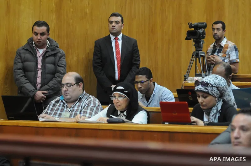 Egyptian supporters of former president Hosni Mubarak attend his trial at the court in Cairo, Egypt, on April 4, 2015. An Egyptian court began a retrial on Saturday of former president Hosni Mubarak and his sons for alle...