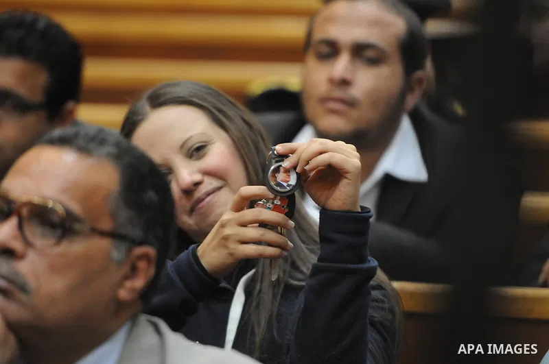 Egyptian supporters of former president Hosni Mubarak attend his trial at the court in Cairo, Egypt, on April 4, 2015. An Egyptian court began a retrial on Saturday of former president Hosni Mubarak and his sons for alle...