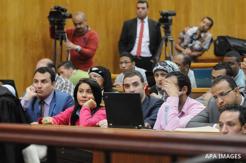 Egyptian supporters of former president Hosni Mubarak attend his trial at the court in Cairo, Egypt, on April 4, 2015. An Egyptian court began a retrial on Saturday of former president Hosni Mubarak and his sons for alle...