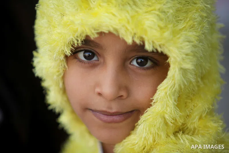 Palestinian children take part in a celebration to mark the Children's Day, at University College of Applied Sciences in Gaza city on April 5, 2015. Photo by Ashraf Amra